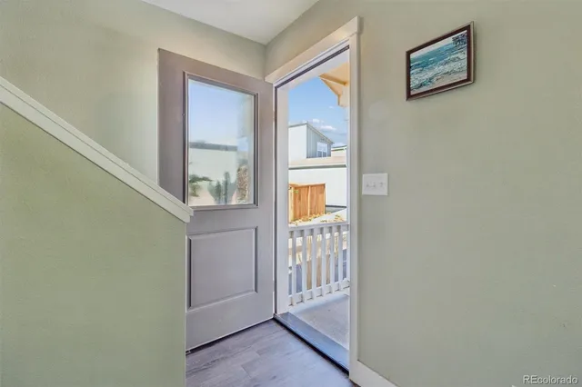 a view of front door with wooden floor