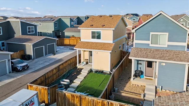 a aerial view of a house with a yard
