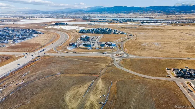 an aerial view of residential building and ocean view