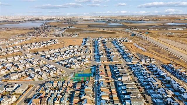 an aerial view of residential building and ocean view