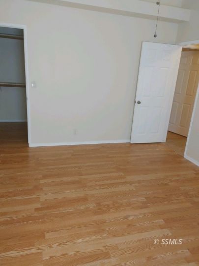 609 East Wilson Avenue Ridgecrest, CA 93555 - Photo 16 of 32 a view of an empty room with wooden floor