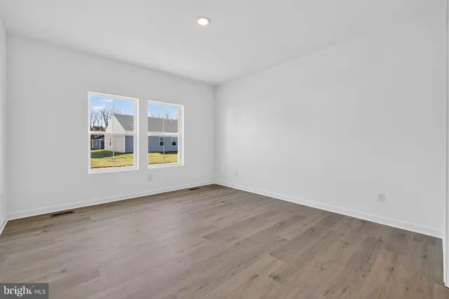 a bathroom with double sink and two mirror