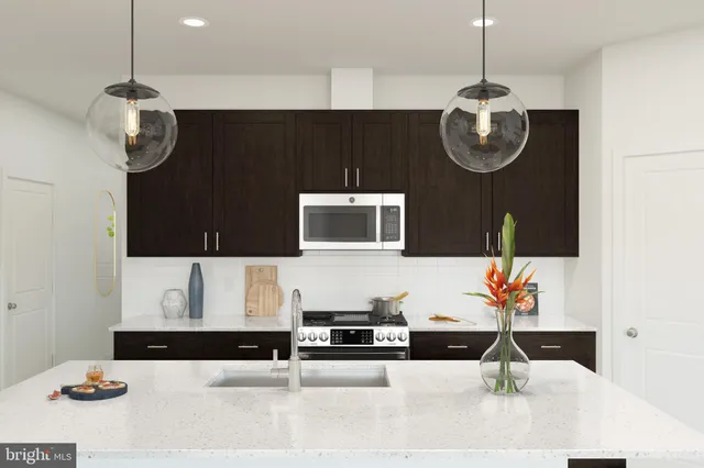 a living room with stainless steel appliances kitchen island granite countertop furniture and living room view