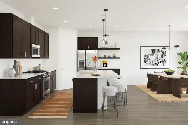 a kitchen with stainless steel appliances kitchen island granite countertop a sink a stove and cabinets