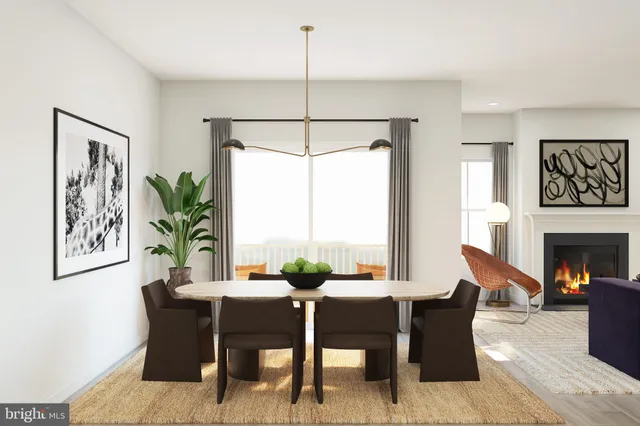 a dining room with furniture a window and a chandelier