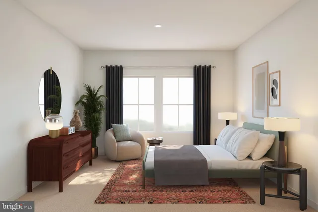 a bedroom with a bed chair and window