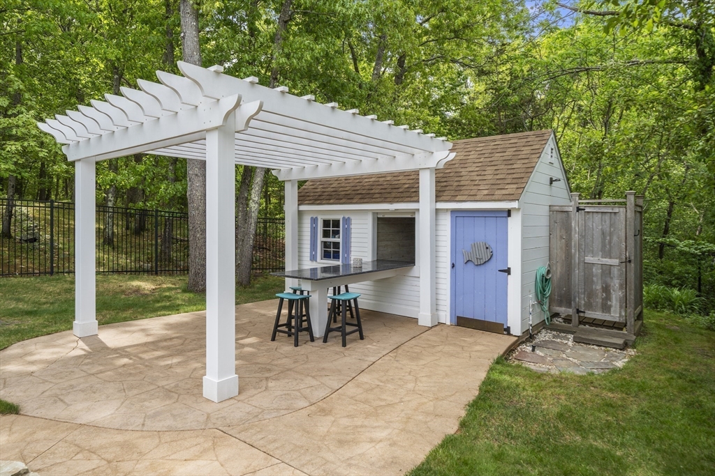 30 Franklin Rodgers Road Hingham, MA 02043 - Photo 33 of 37 a backyard of a house with yard barbeque oven and outdoor seating