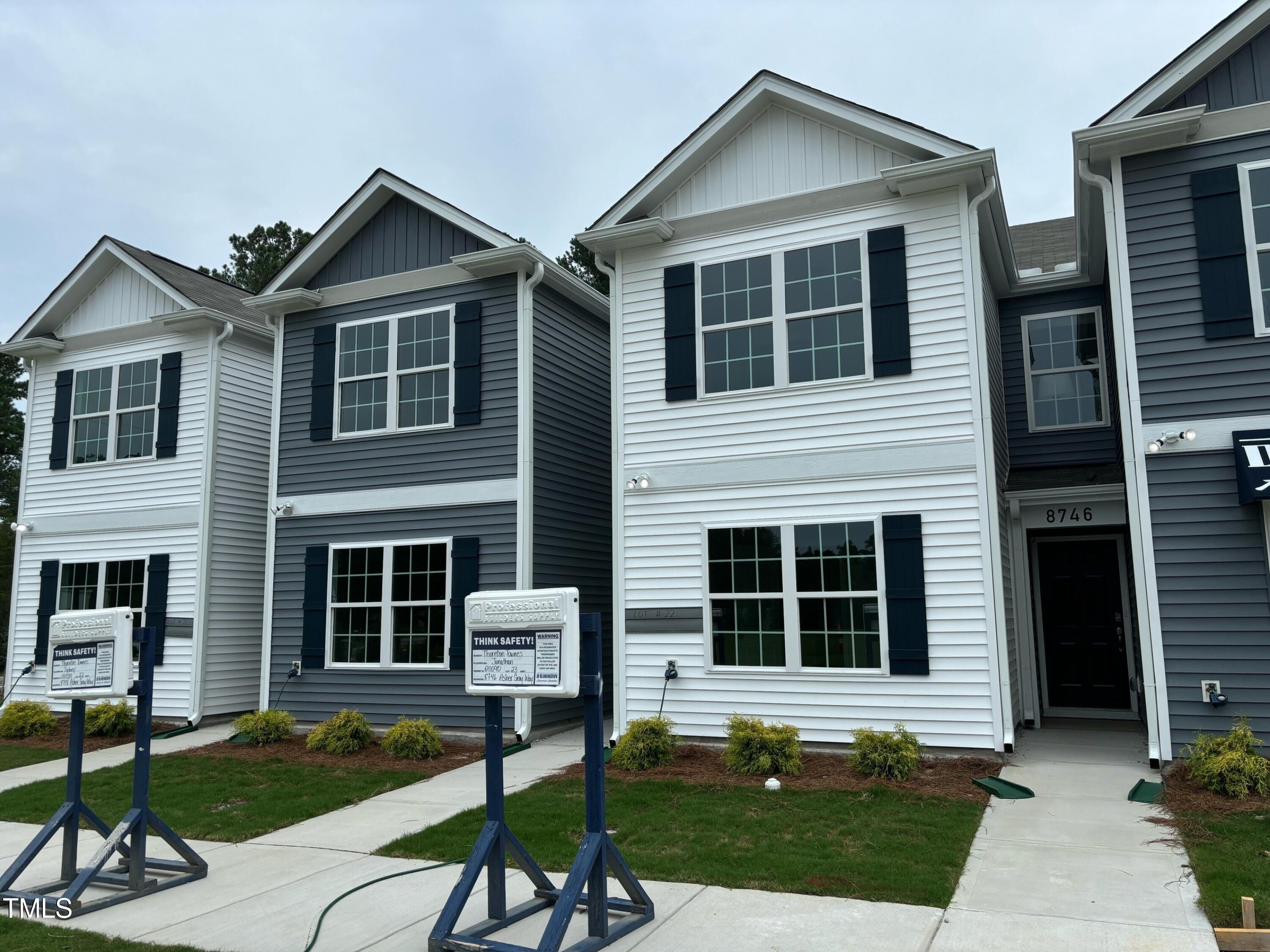 8734 Asher Gray Way Raleigh, NC 27616 - Photo 1 of 22 a front view of a house with a yard