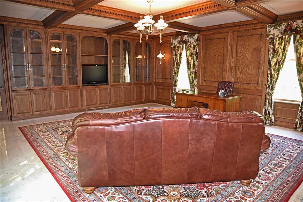 320 McCullough Road Sharpsville, PA 16150 - Photo 11 of 25 Den has beaned ceiling built in cabinets also features a fireplace