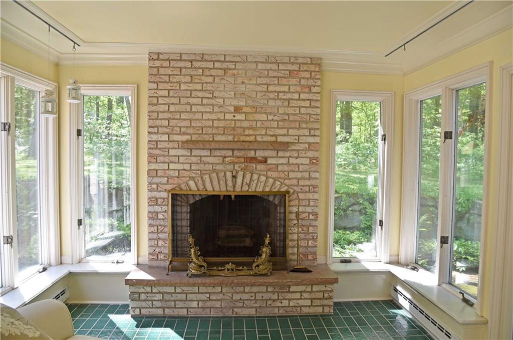 320 McCullough Road Sharpsville, PA 16150 - Photo 13 of 25 ceramic tiled sunroom with fireplace