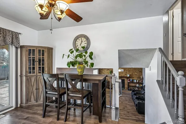 a view of a dining room with furniture and chandelier
