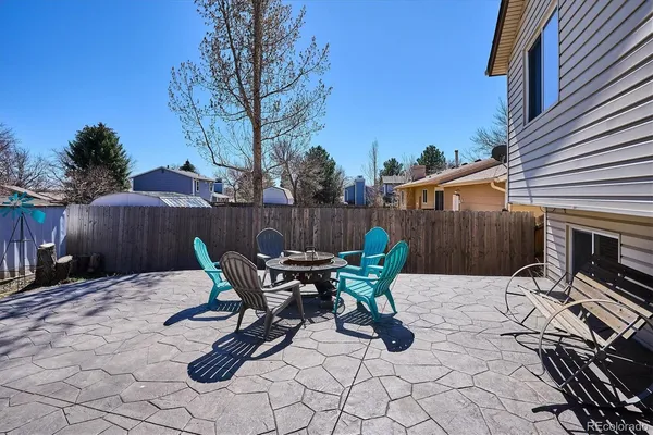a view of backyard with furniture and outdoor seating