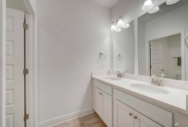 a bathroom with a sink and a mirror