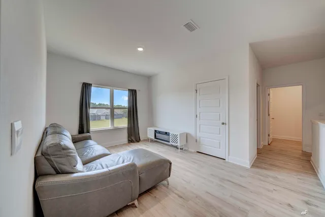 a living room with furniture and a window