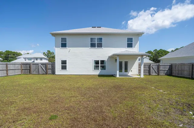 a front view of house with an outdoor space and seating