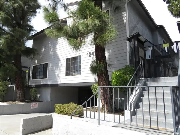 a view of a house with a iron gate