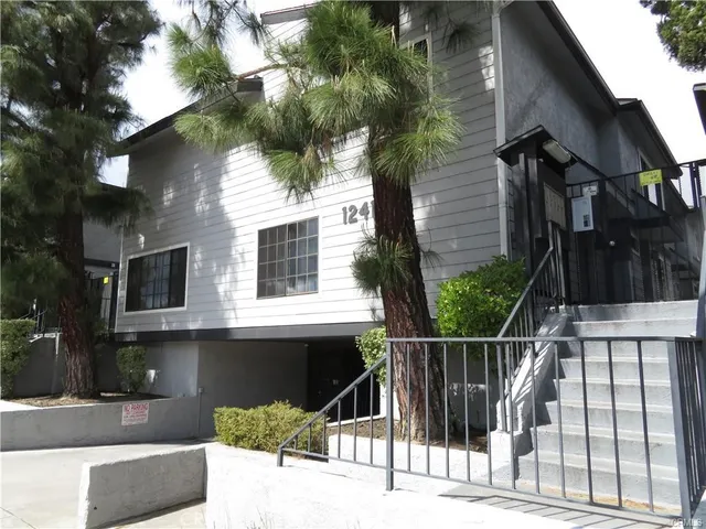 a view of a house with a iron gate