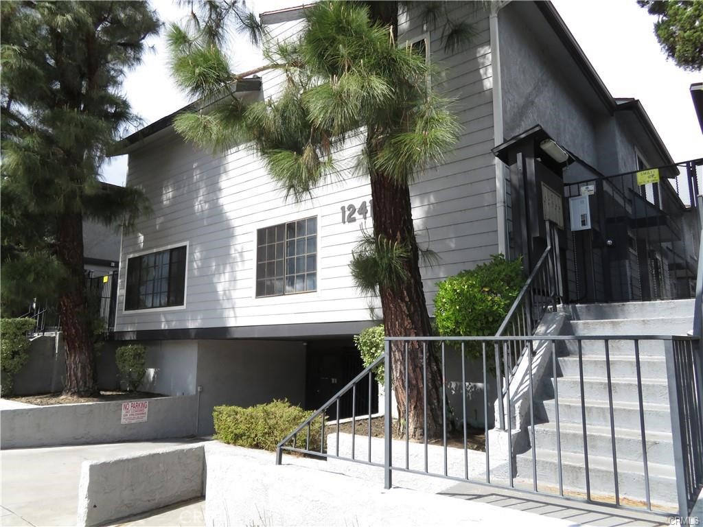 a view of a house with a iron gate
