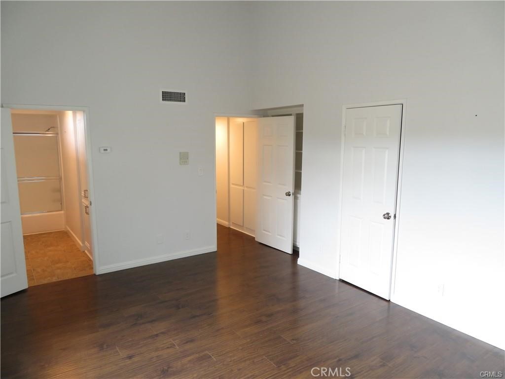 12415 Riverside Drive, Unit 1 Valley Village, CA 91607 - Photo 11 of 16 a view of an empty room with wooden floor