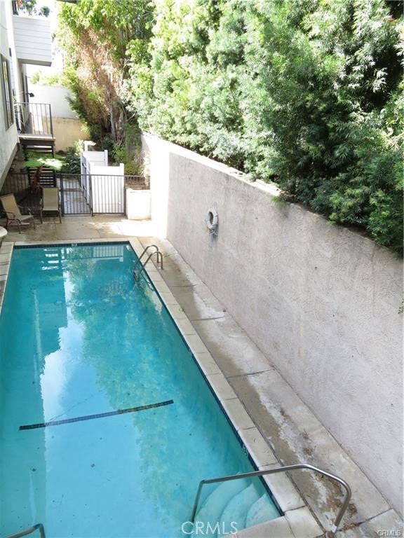 12415 Riverside Drive, Unit 1 Valley Village, CA 91607 - Photo 16 of 16 a view of a swimming pool with a patio