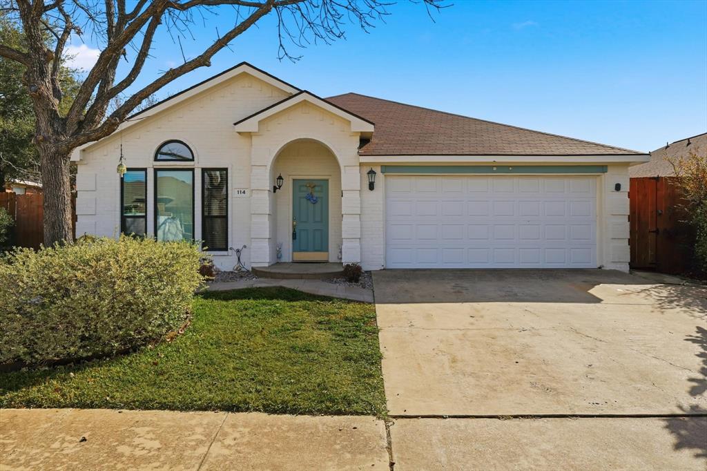 114 Drake Lane Garland, TX 75043 - Photo 1 of 27 a front view of a house with garden
