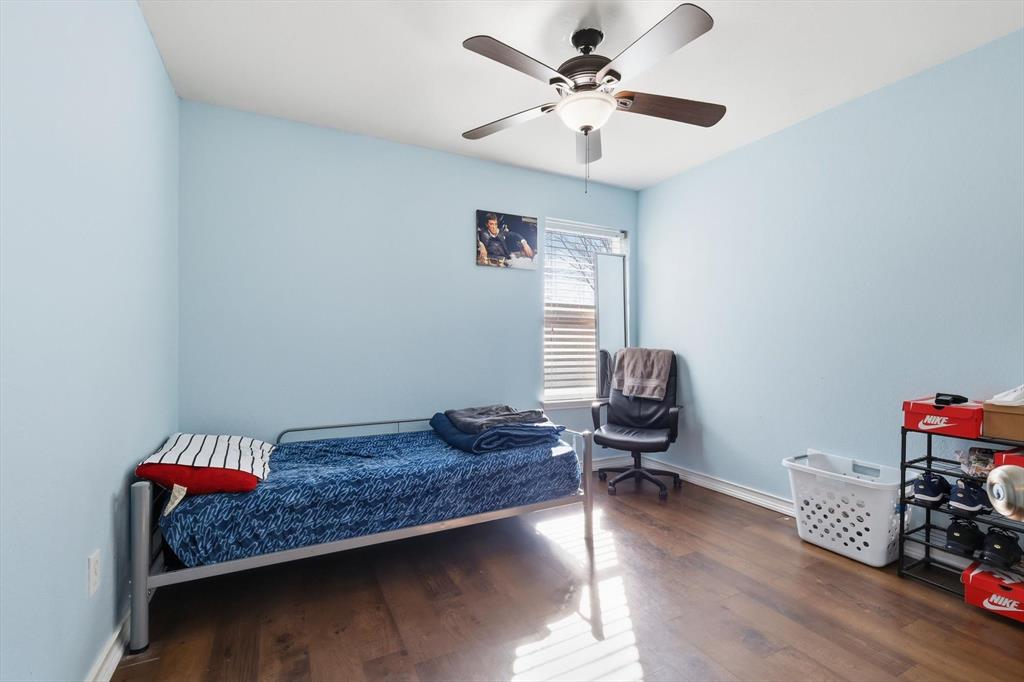 114 Drake Lane Garland, TX 75043 - Photo 20 of 27 a living room with furniture and a wooden floor