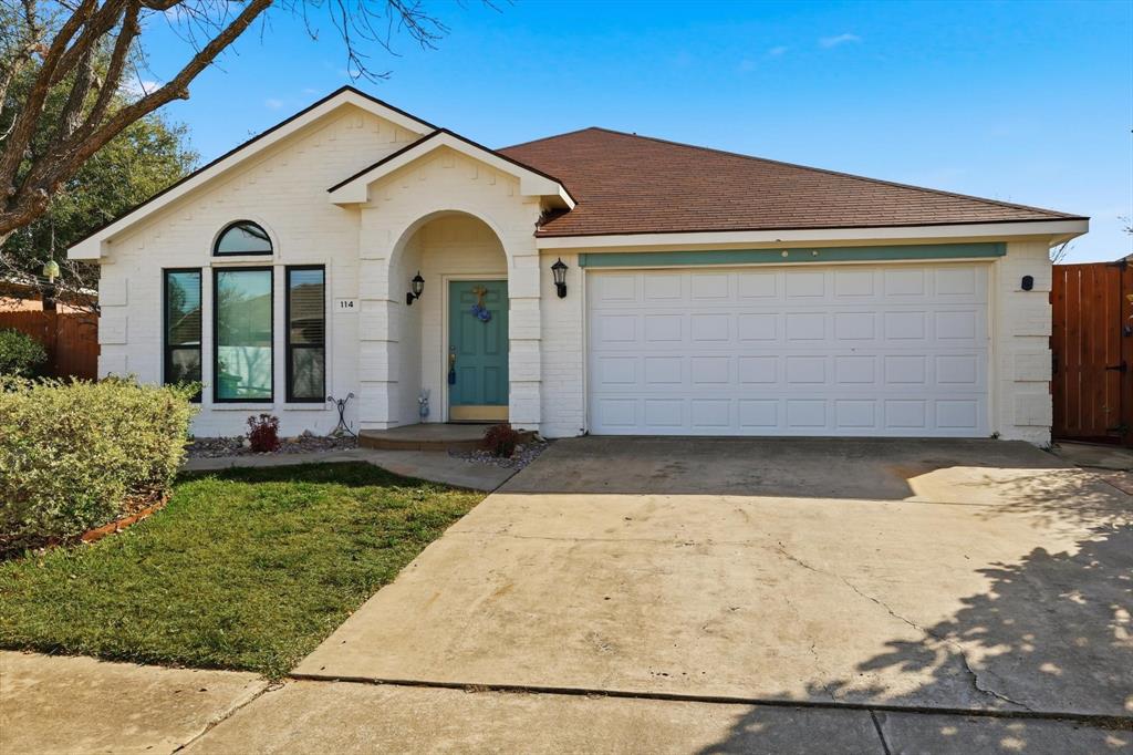 114 Drake Lane Garland, TX 75043 - Photo 2 of 27 a front view of a house with garden