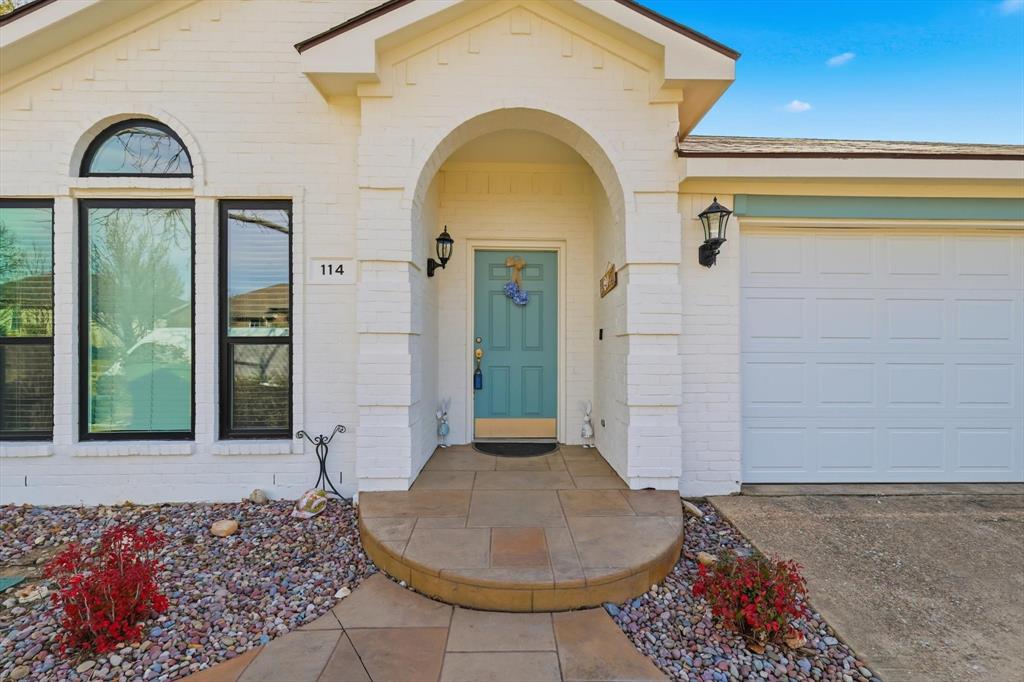 114 Drake Lane Garland, TX 75043 - Photo 4 of 27 a view of a brick house with a window