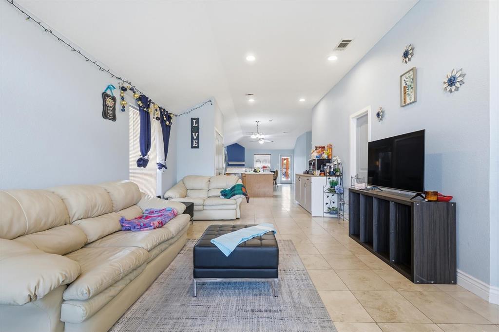 114 Drake Lane Garland, TX 75043 - Photo 6 of 27 a living room with furniture and a flat screen tv