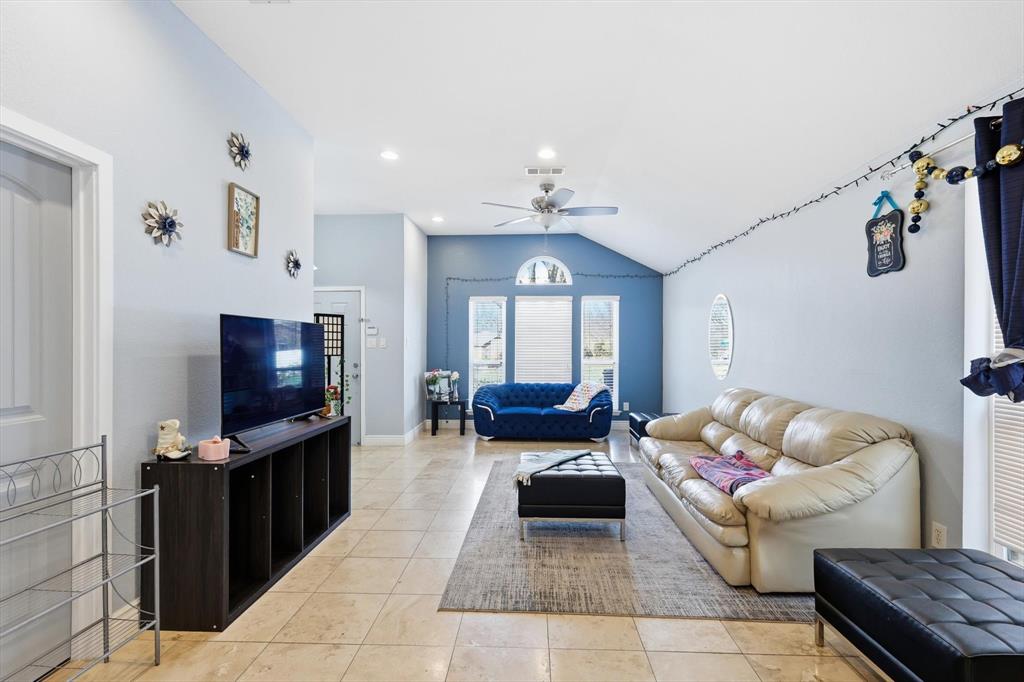 114 Drake Lane Garland, TX 75043 - Photo 8 of 27 a living room with furniture and a flat screen tv