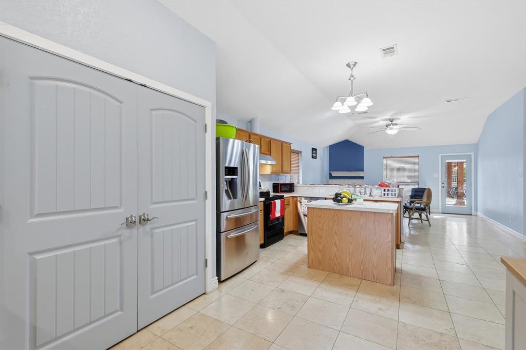 114 Drake Lane Garland, TX 75043 - Photo 10 of 27 a view of kitchen with stainless steel appliances cabinets and chair