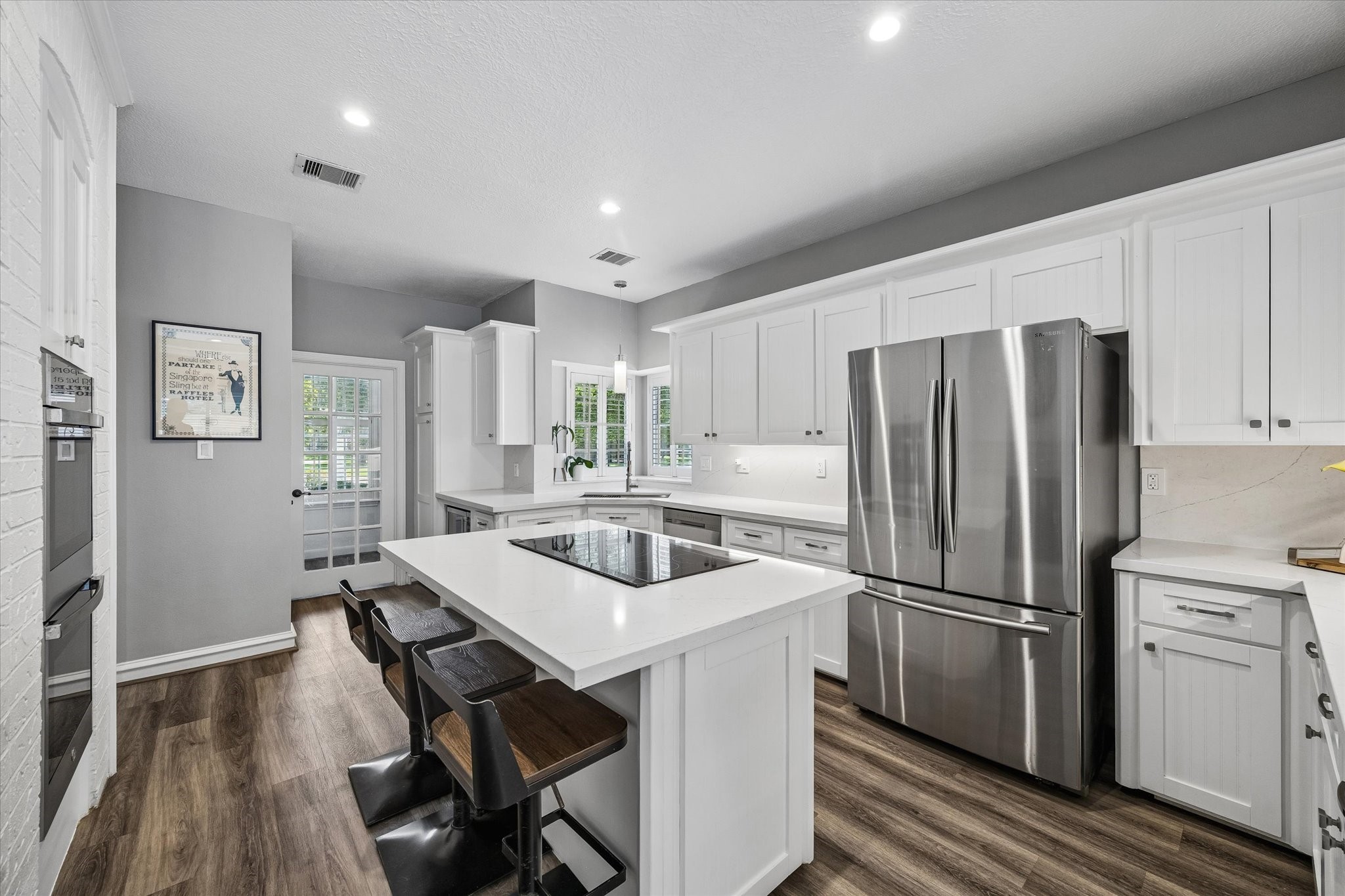 146 Golden Shadow Circle Spring, TX 77381 - Photo 15 of 41 The kitchen boasts ample storage space for all of your culinary needs and a large island with seating, ideal for both casual dining and entertainment.