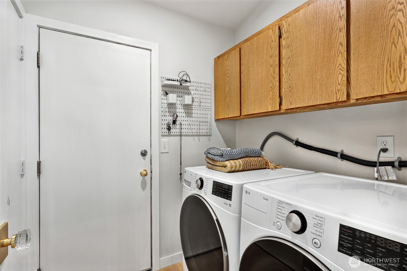 5126 South Garden Loop Road, Unit 11 Seattle, WA 98118 - Photo 21 of 36 a utility room with dryer and washer