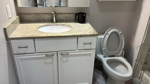 a view of a chairs and tables in the balcony