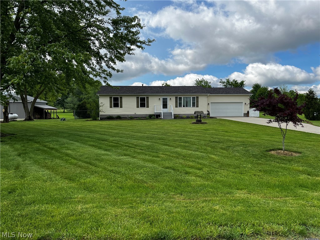 6876 Clark Road Atwater, OH 44201 - Photo 40 of 41 Ranch-style home with a front lawn and a garage