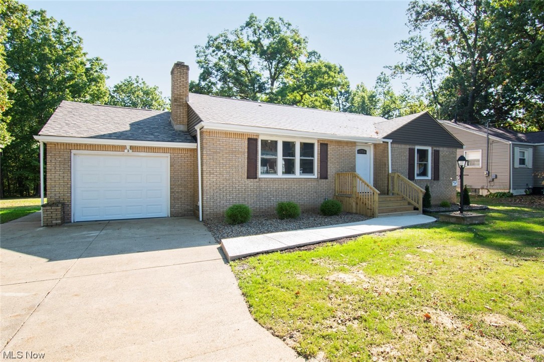 1097 South Meridian Road Youngstown, OH 44511 - Photo 2 of 29 Single story home featuring a front lawn and a garage