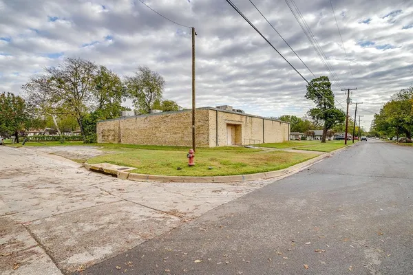 a view of a playground with basketball court
