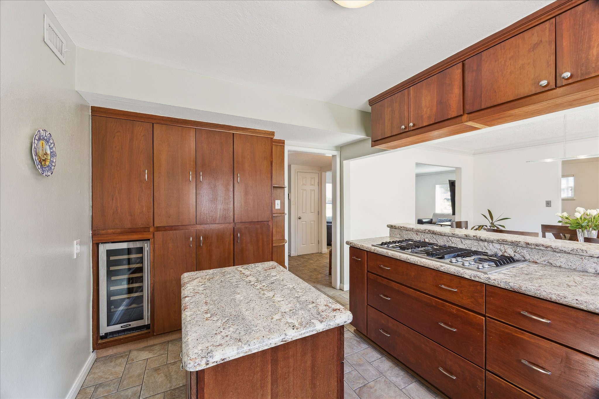 4388 Fiesta Lane Houston, TX 77004 - Photo 11 of 24 a kitchen with granite countertop wooden cabinets and a stainless steel appliances