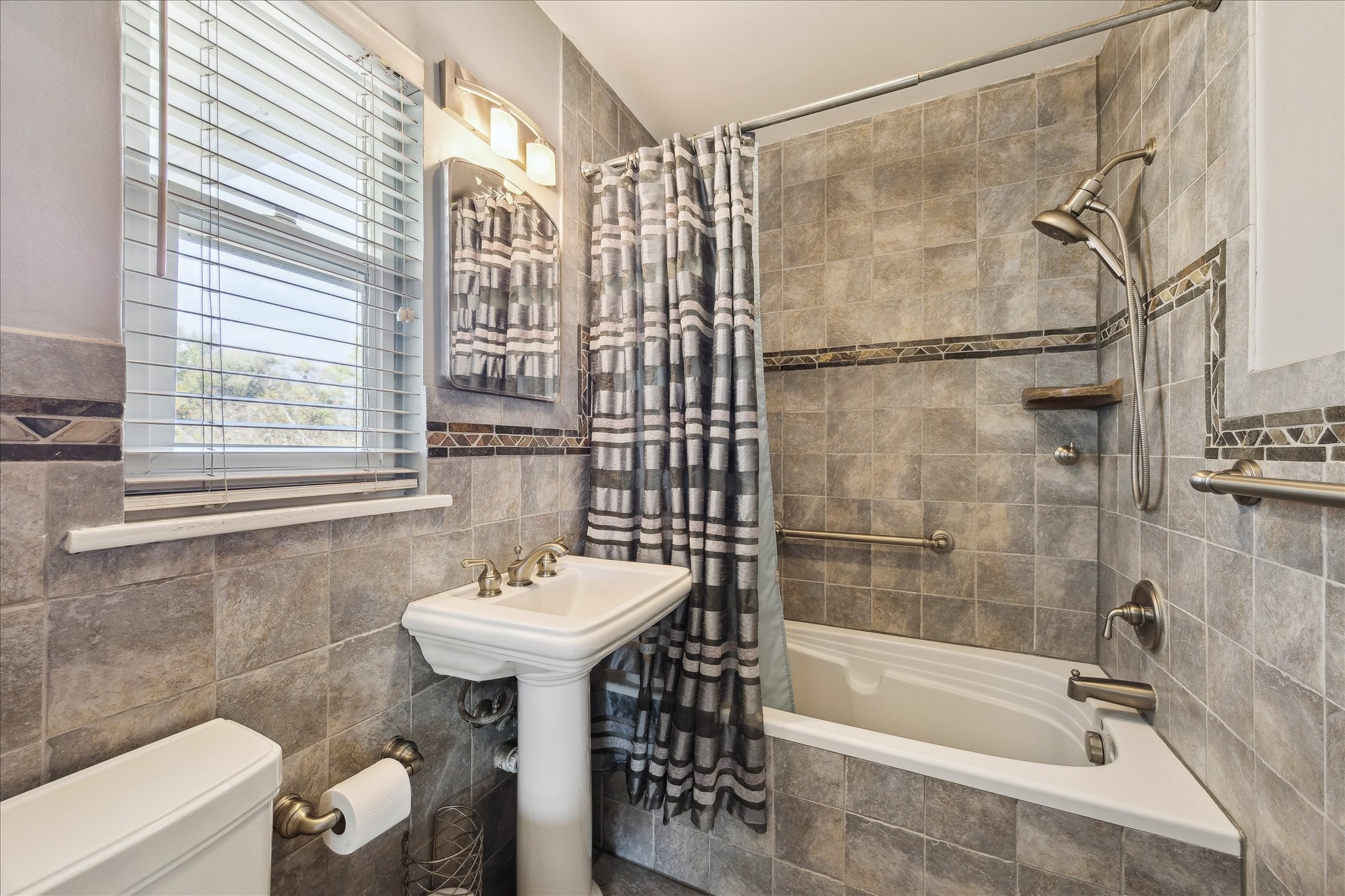4388 Fiesta Lane Houston, TX 77004 - Photo 14 of 24 a bathroom with a sink and a mirror