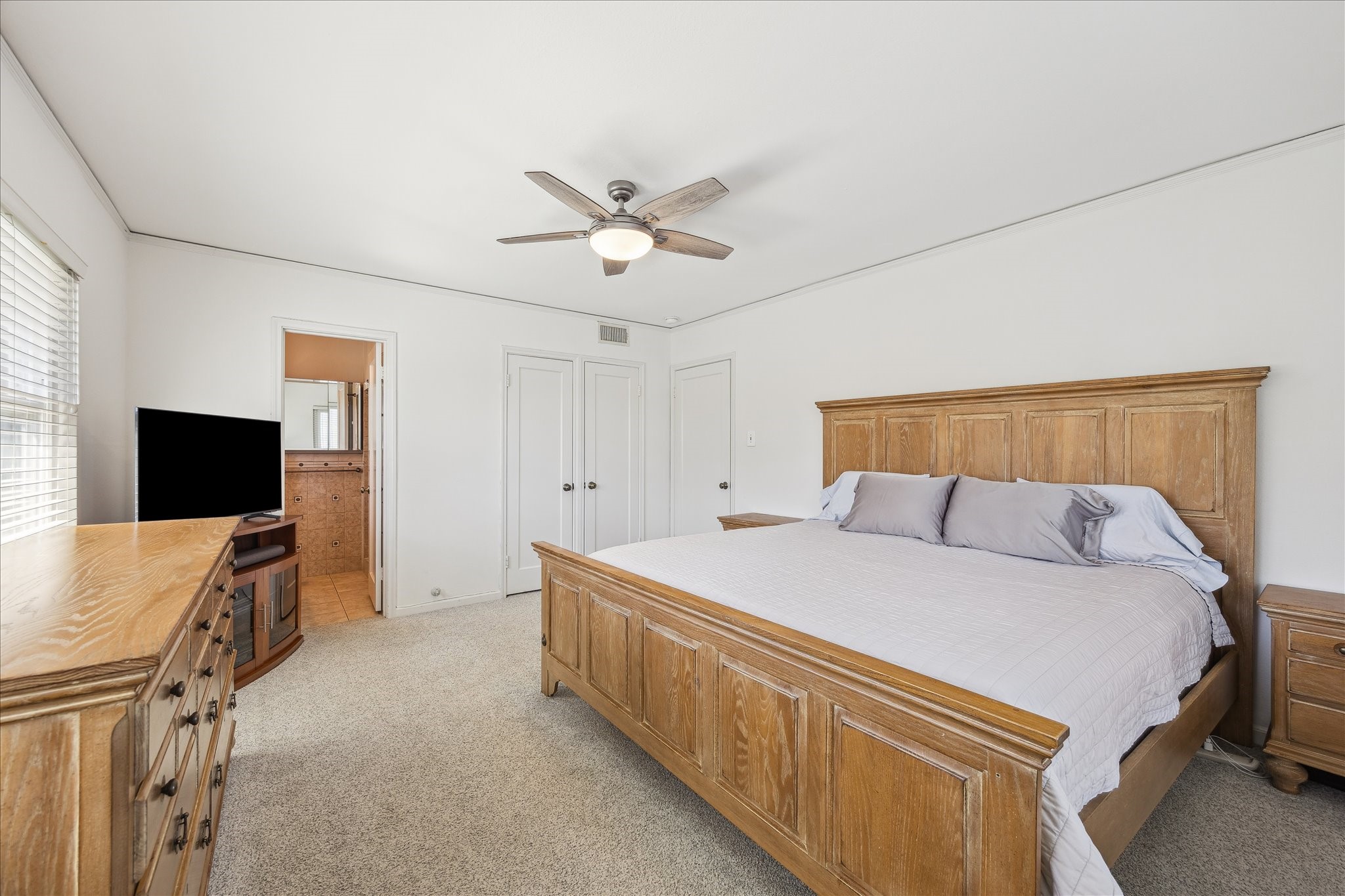 4388 Fiesta Lane Houston, TX 77004 - Photo 16 of 24 a bedroom with a bed and a flat screen tv