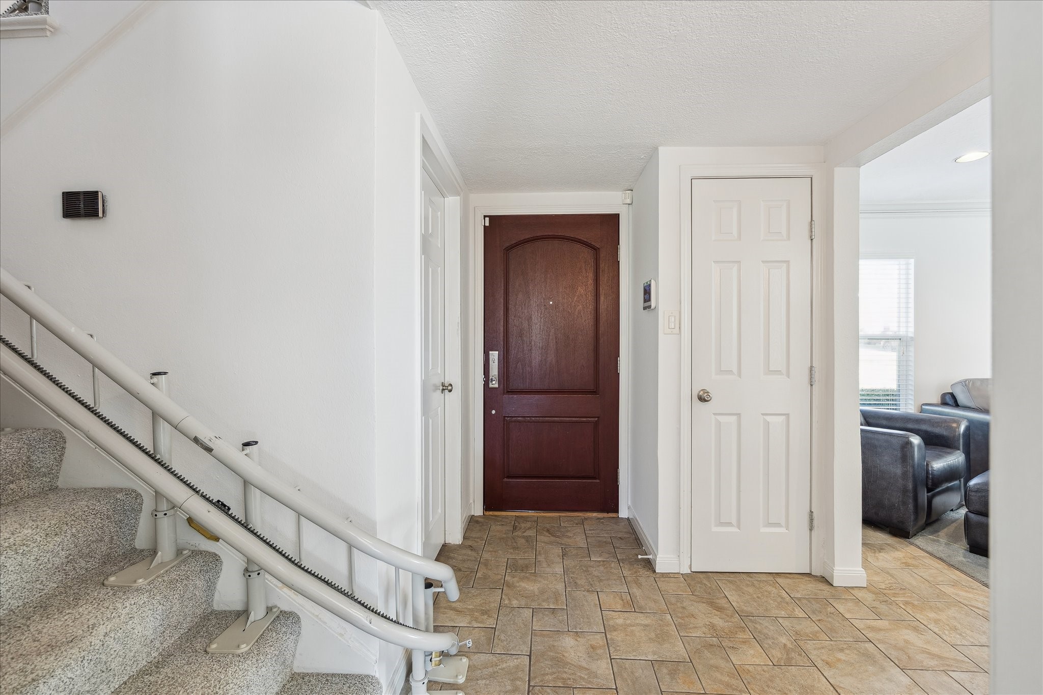 4388 Fiesta Lane Houston, TX 77004 - Photo 3 of 24 a view of a hallway with closet and stairs