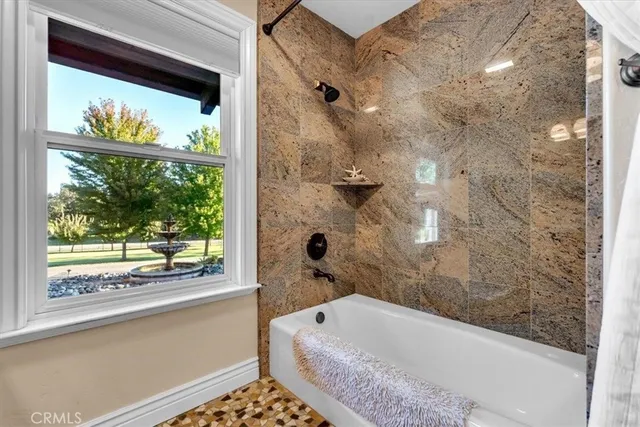 an aerial view of a house a yard and a garden