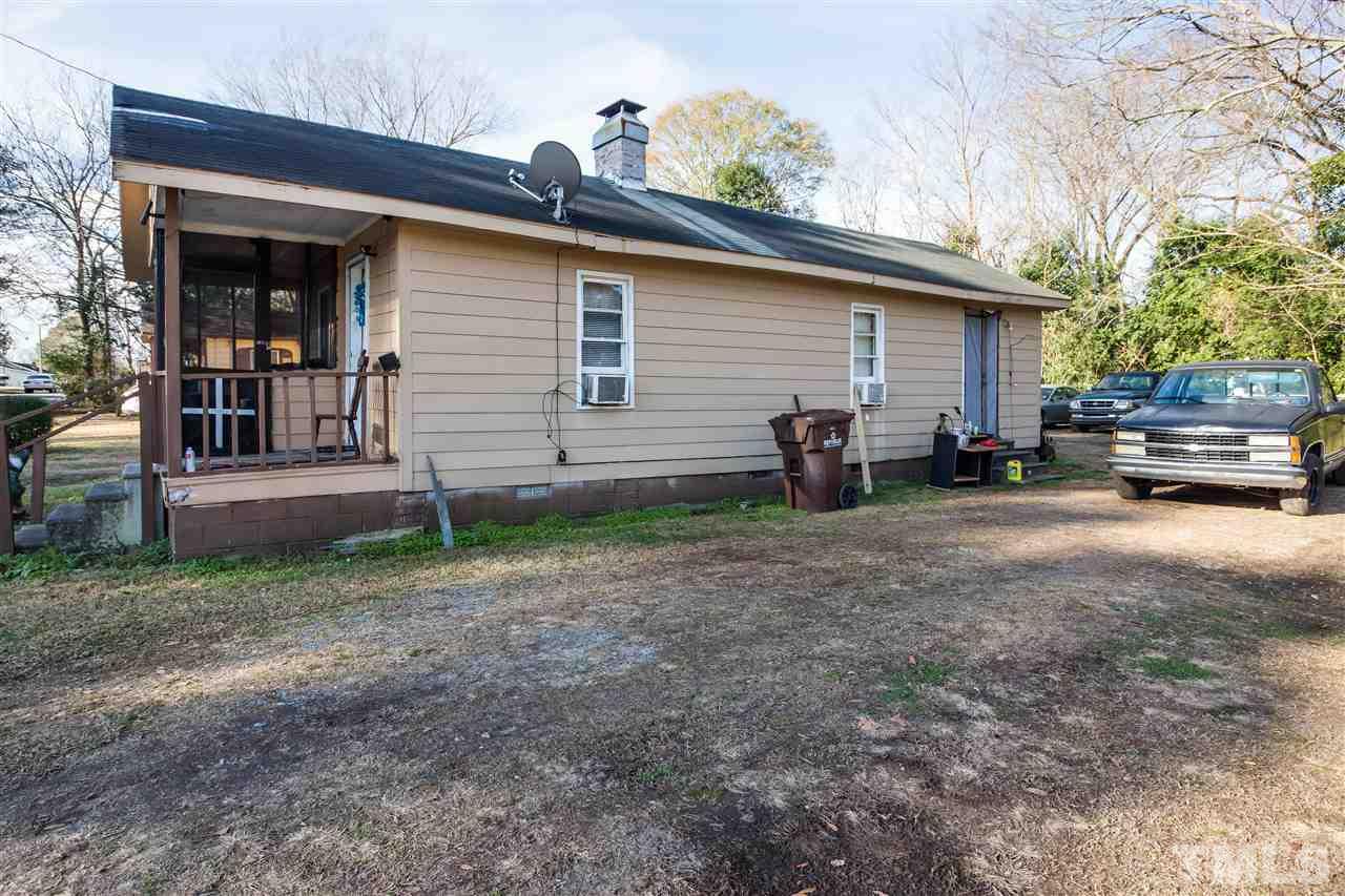 207 Jackson Street Dunn, NC 28334 - Photo 3 of 4 a view of a house with backyard
