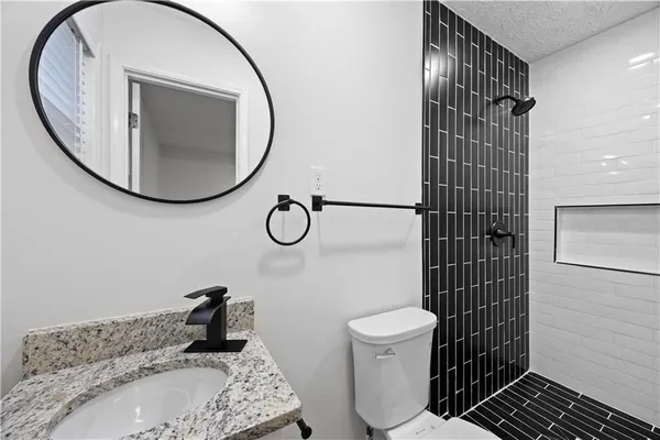 a bathroom with a toilet and a sink