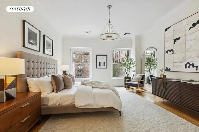 a view of a backyard with brick wall and potted plants