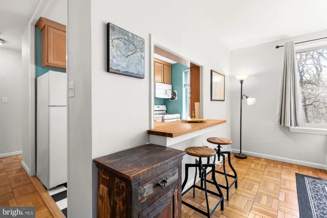 a view of a room with furniture and window