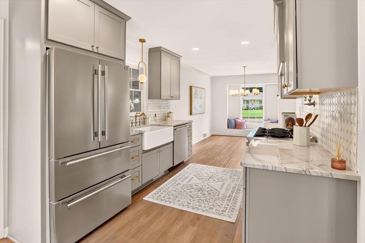 7674 Apple Valley Road Germantown, TN 38138 - Photo 8 of 15 Modern kitchen featuring a stainless steel French door refrigerator, light gray cabinetry, a farmhouse sink, and a marble-look countertop