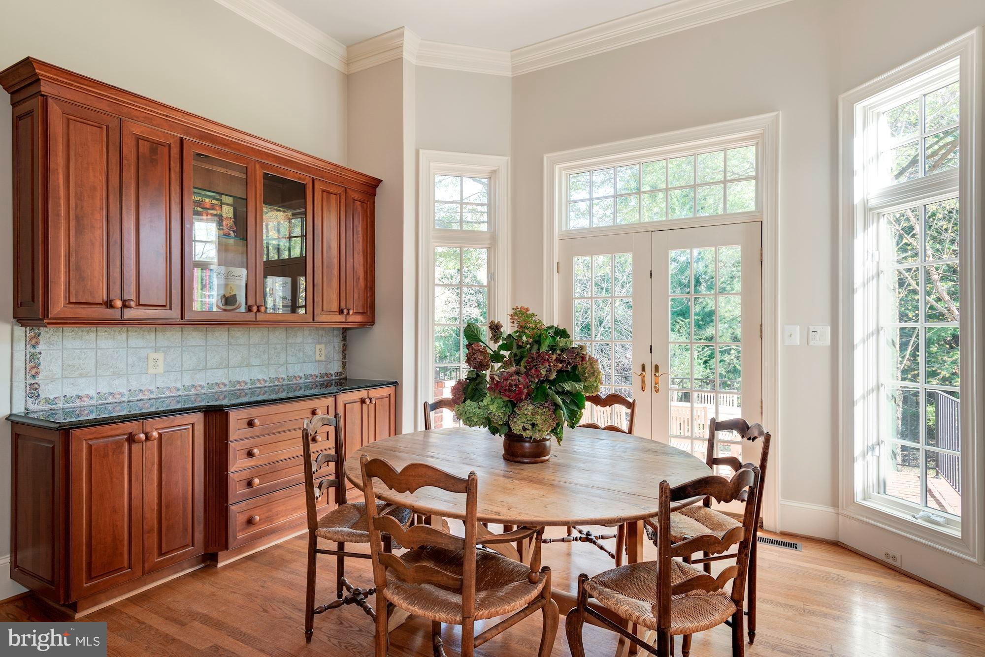 1099 Langley Fork Lane McLean, VA 22101 - Photo 14 of 33 a dining room with furniture and wooden floor