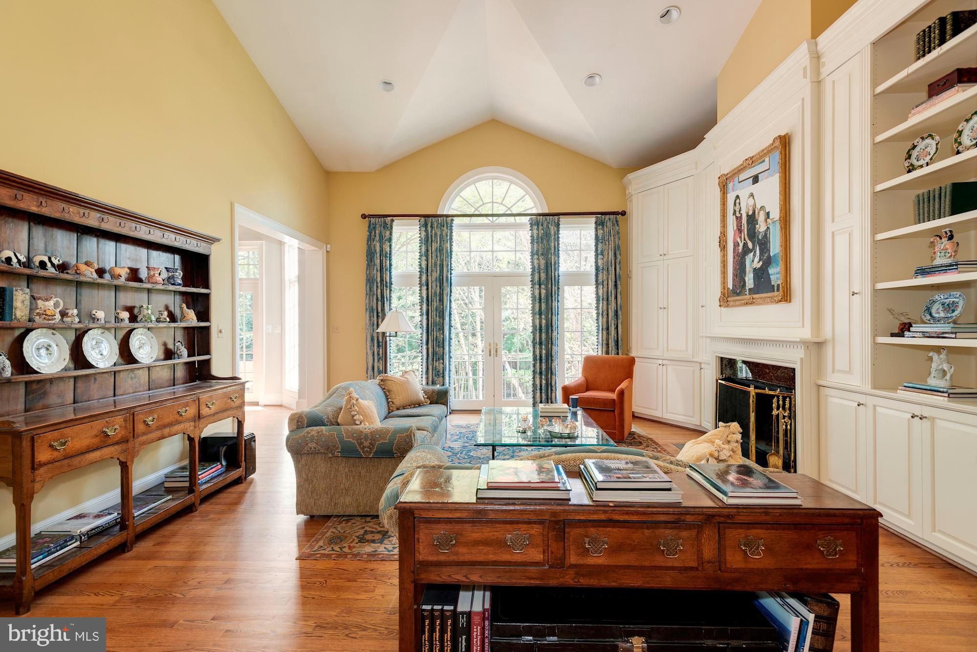 1099 Langley Fork Lane McLean, VA 22101 - Photo 15 of 33 a living room with furniture a fireplace and a large window