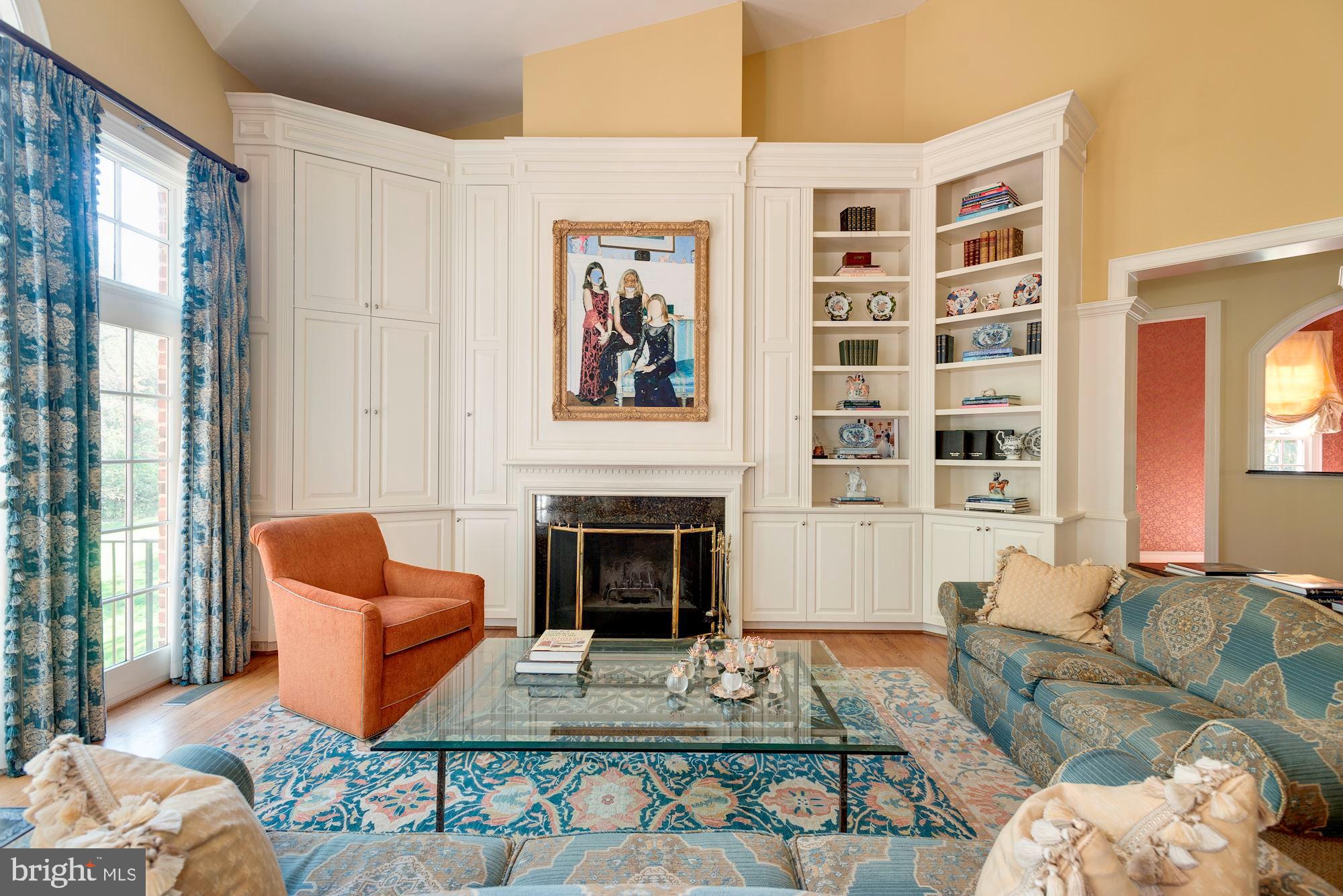 1099 Langley Fork Lane McLean, VA 22101 - Photo 16 of 33 a living room with furniture a rug and a fireplace